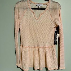 Blush pink, peplum, waffle knit long sleeve top.